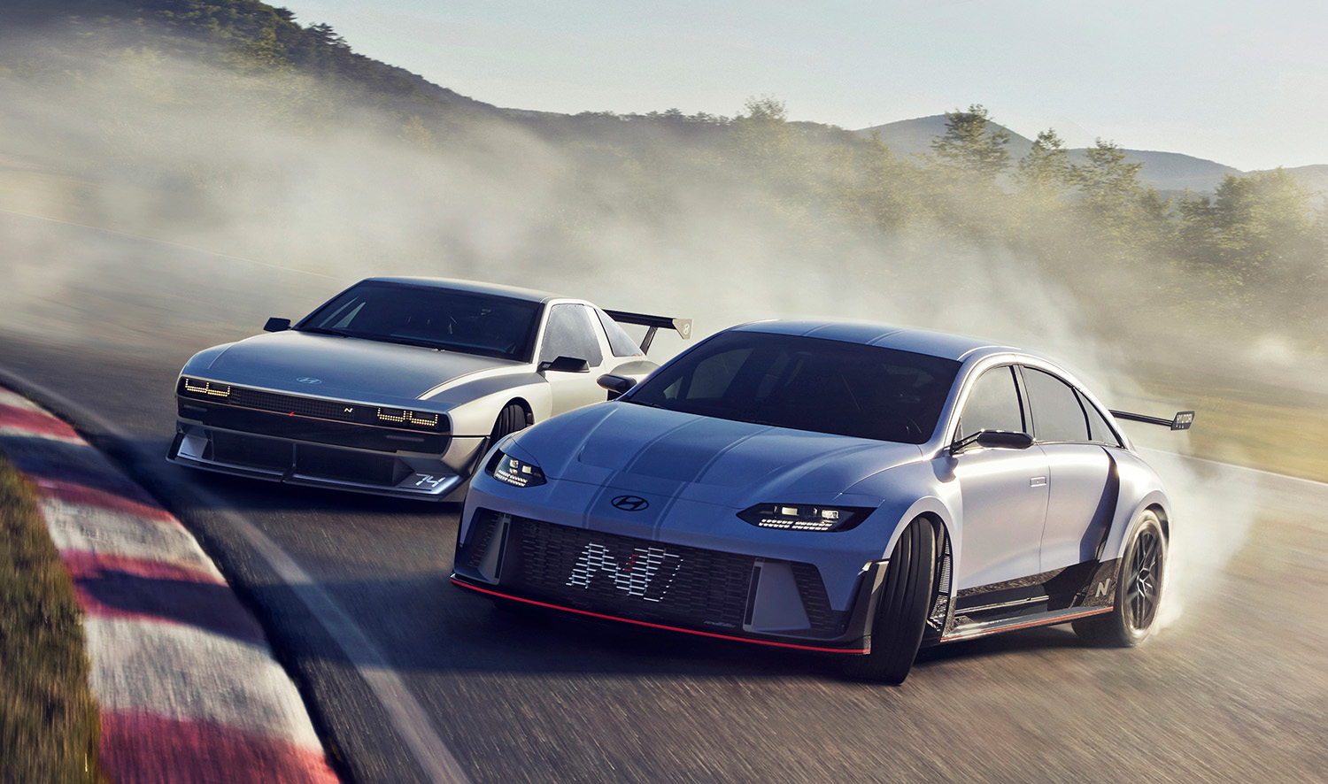 Hyundai RN22e and N Vision 74 electric sports car concepts drifting together on race track