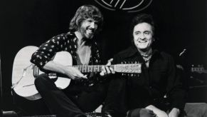 Kris Kristofferson (L) and Johnny Cash (R) performing a duet on 'The Johnny Cash Show' in 1976