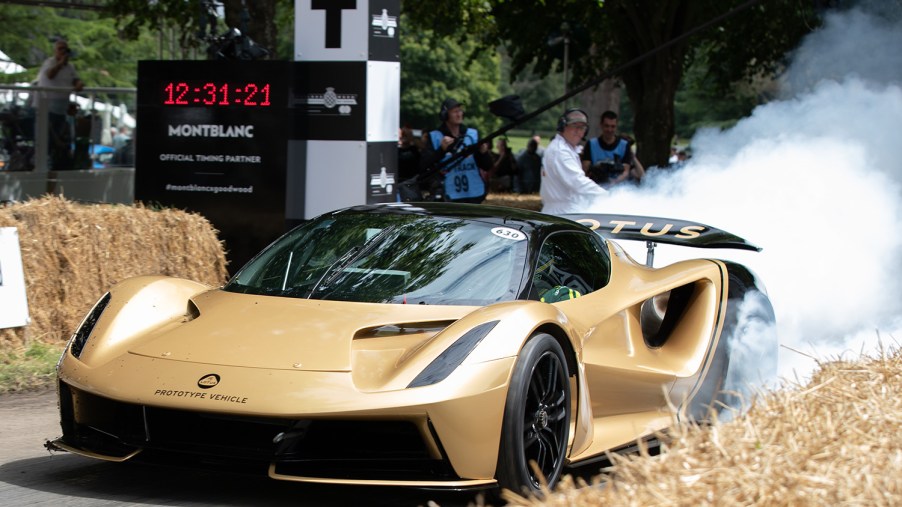 Lotus Evija displaying the power of electric hypercars doing a burnout as it leaves the line at Goodwood Festival of Speed