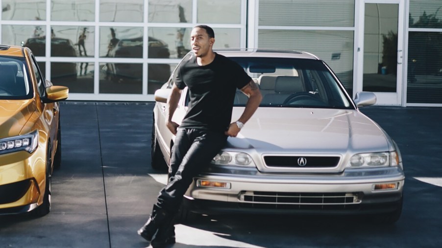 Rapper Ludacris with his 1993 Acura Legend at Acura facility in LA after restoration