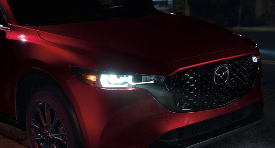 The front of a red Mazda CX-5 2.5 S Premium compact SUV. 