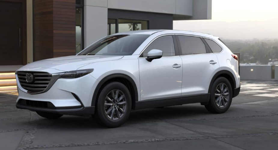 A gray 2022 Mazda CX-9 midsize SUV is parked. 