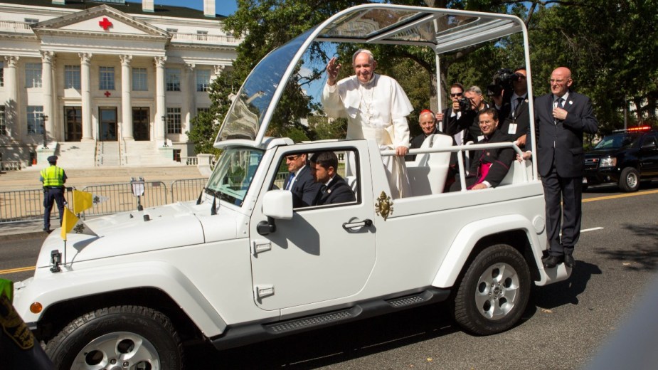Pope Francis rides in the Popemobile around D.C.'s National Mall