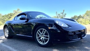 Black 2007 Porsche Cayman front 3/4 parked in parking lot for Cars and Bids auction photos