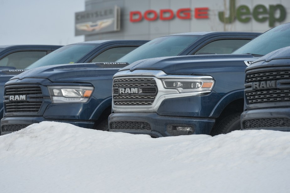 Ram trucks lined up, which is one of the trucks with the least amount of ground clearance. 