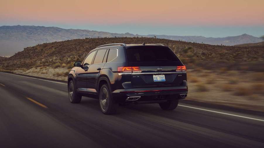 Rear angle view of black Front angle view of black 2023 VW Atlas midsize SUV, highlighting its release date and price
