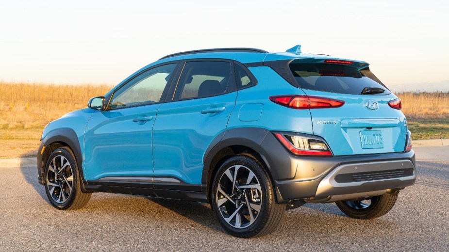 Rear angle view of blue 2023 Hyundai Kona, highlighting its release date and price