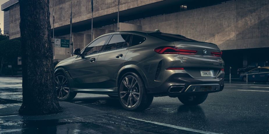 Rear angle view of gray 2023 BMW X6 luxury SUV, highlighting its release date and price