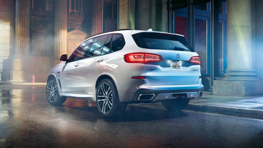 Rear angle view of white 2023 BMW X5, highlighting its release date and price