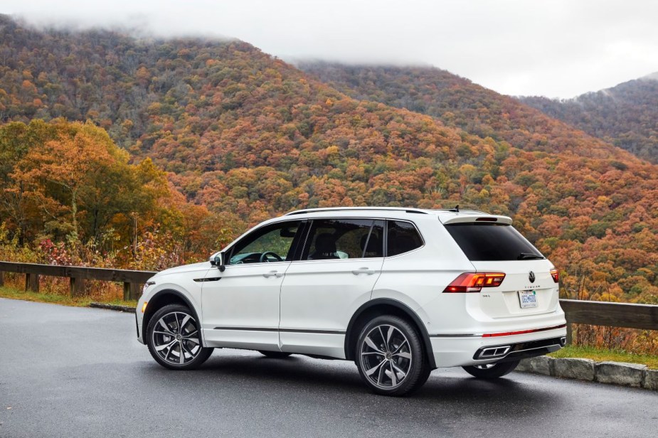 Rear angle view of white 2023 VW Tiguan crossover SUV, highlighting its release date and price