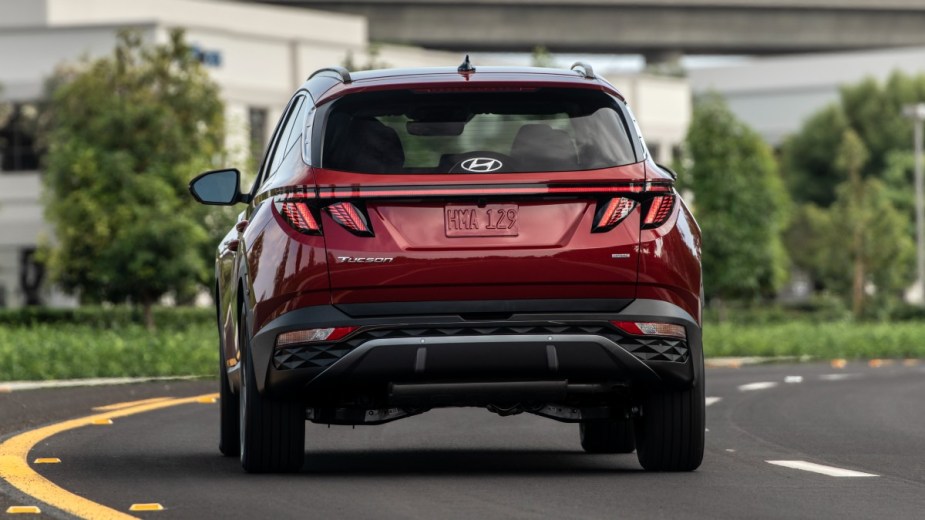 Rear view of red 2023 Hyundai Tucson, highlighting its release date and price