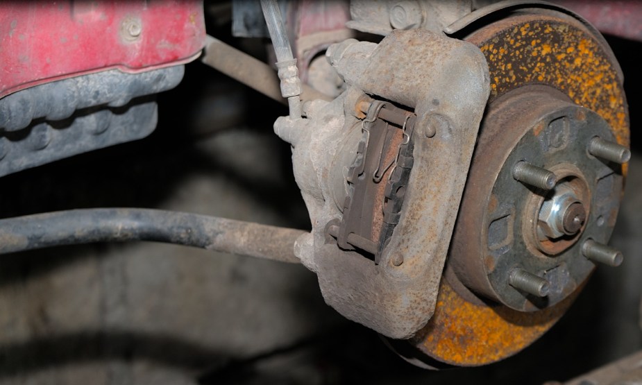 A Rusty Brake Rotor and Frozen Caliper Could Cause Excess Brake Dust