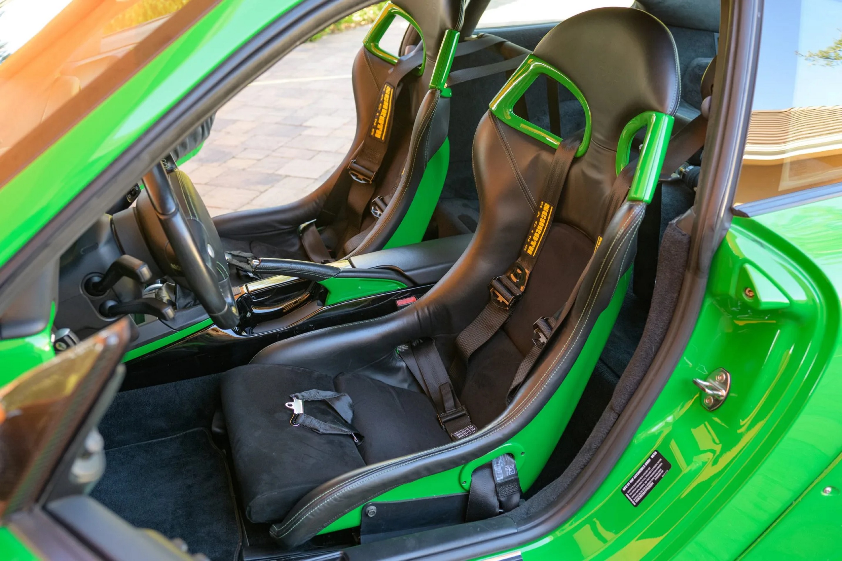 The black-leather-and-Viper-Green Recaro seats and Alcantara-upholstered interior of a Viper Green Sharkwerks-modified 2007 RUF RGT