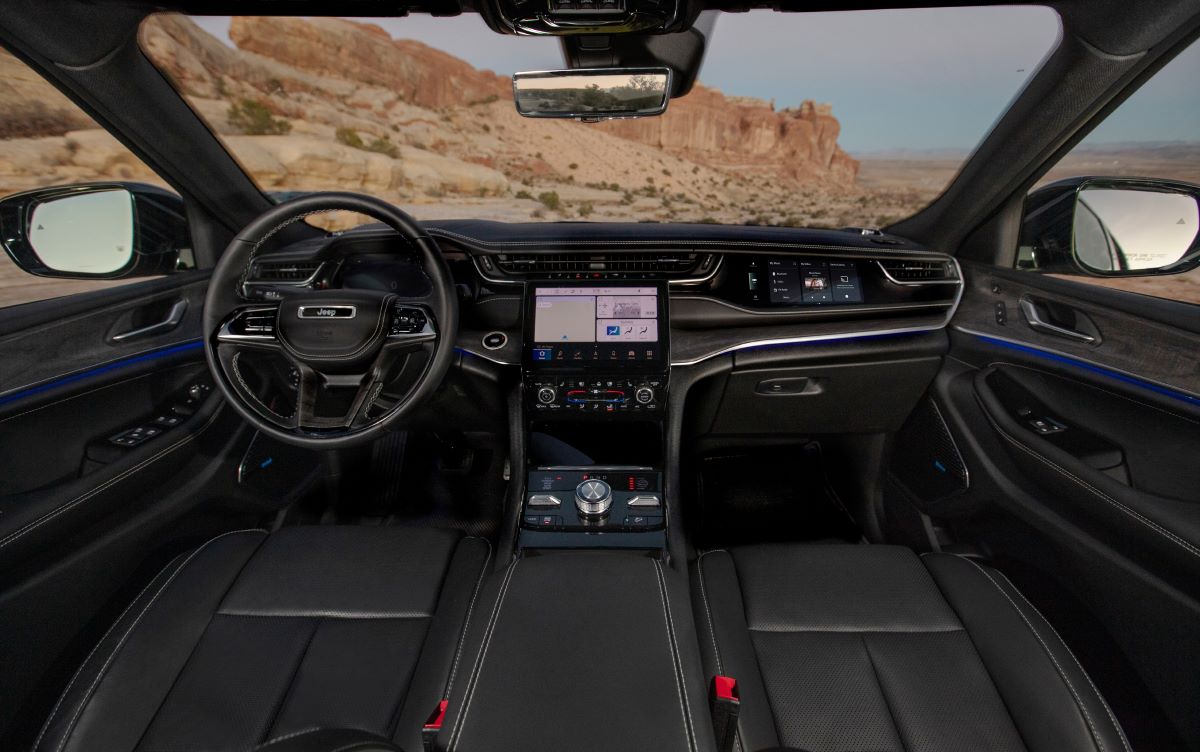 Steering wheel and front seats in 2023 Jeep Grand Cherokee, highlighting its release date and price