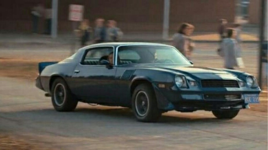 Billy Hargrove's Chevrolet Camaro cruising through the Hawkins parking lot during Stranger Things season two.