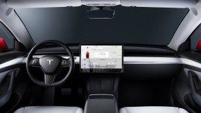 A Tesla Model 3's interior is simple yet befitting of a luxury car.