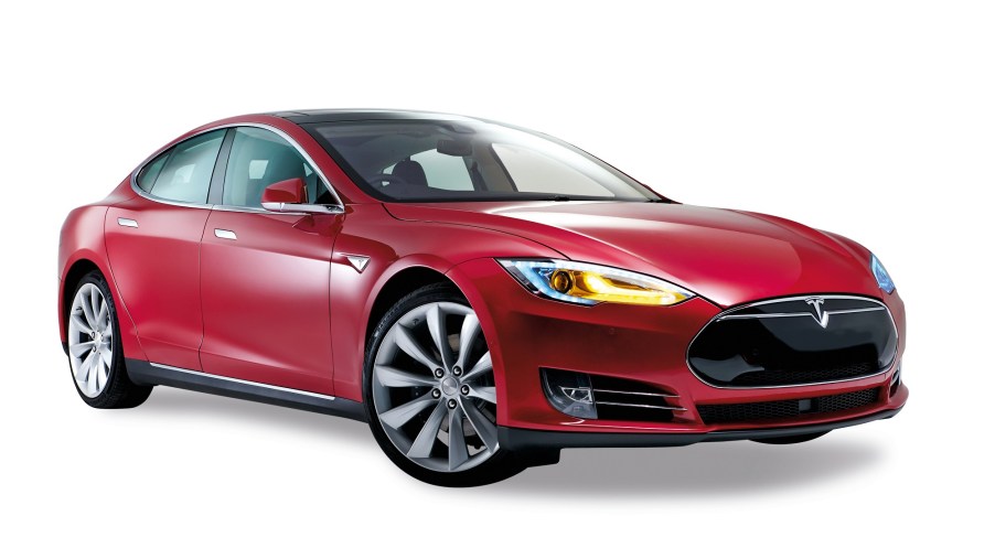 A Tesla Model S, like this one in red, can make you money by flipping cars.