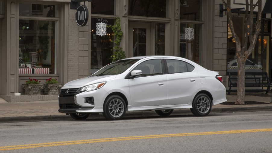 A white 2022 Mitsubishi Mirage G4 Special Edition compact sedan parked on city street