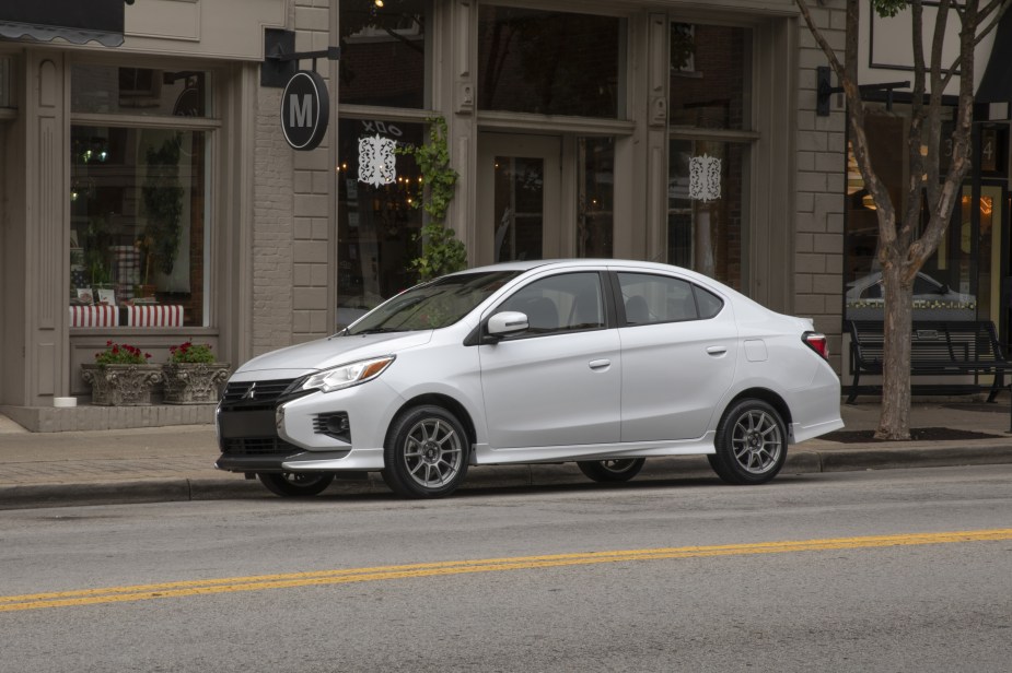 A white 2022 Mitsubishi Mirage G4 Special Edition compact sedan parked on city street