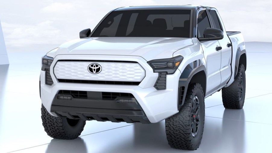 A white Toyota Tacoma Electric pickup truck.