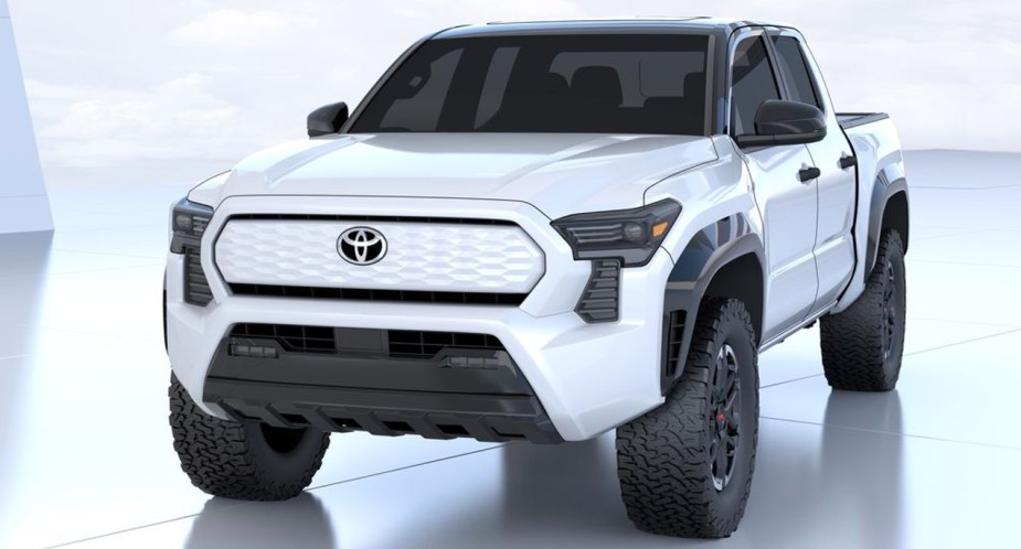 A white 2024 Toyota Tacoma Electric pickup truck. 