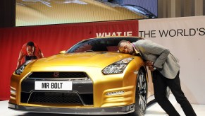 Usain Bolt with Rare Gold Nissan GTR from Car Collection at Nissan's headquarters in Yokohama
