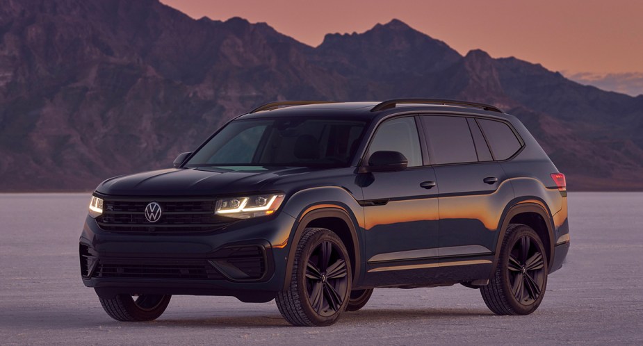 A black 2022 Volkswagen Atlas midsize SUV is parked outdoors.
