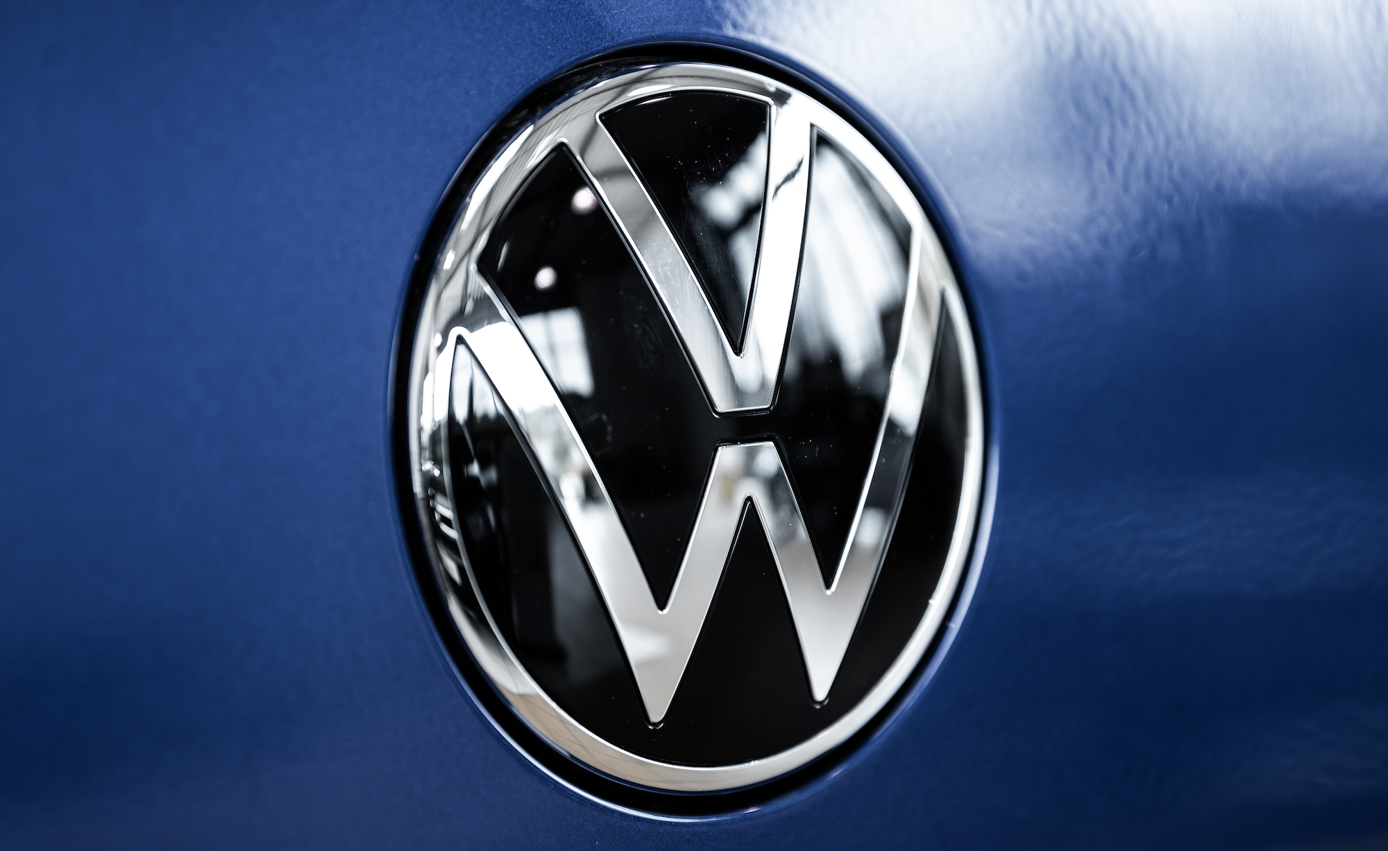 A Volkswagen logo, which owns various brands.