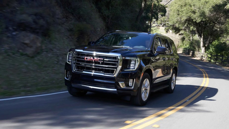 A 2022 GMC Yukon Denali full-size SUV behind the wheel.  The most popular trim is not the best option.