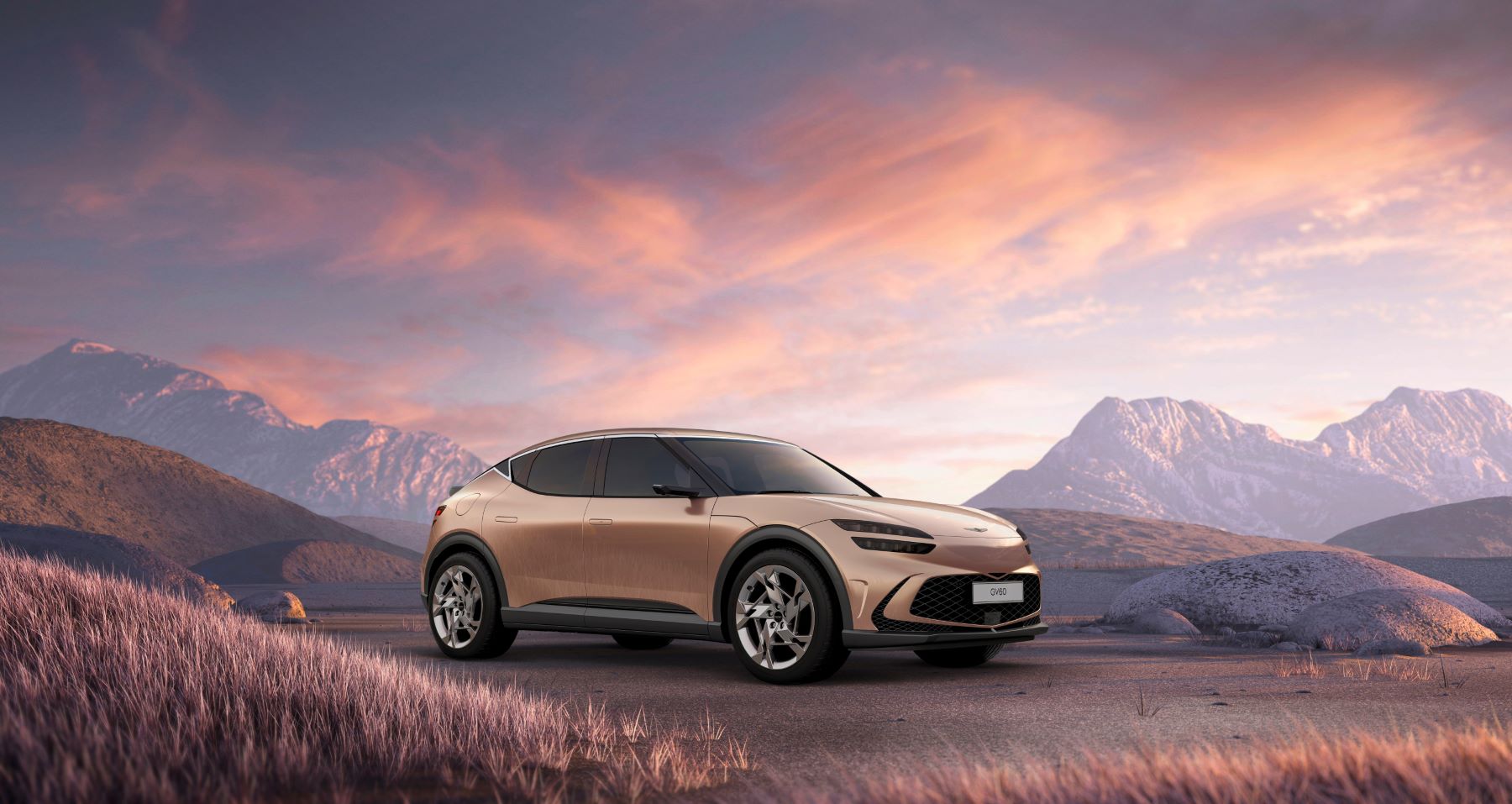 A bronze 2023 Genesis GV60 electric SUV model parked in a mountain field bathed in light from a purple cloudy sky