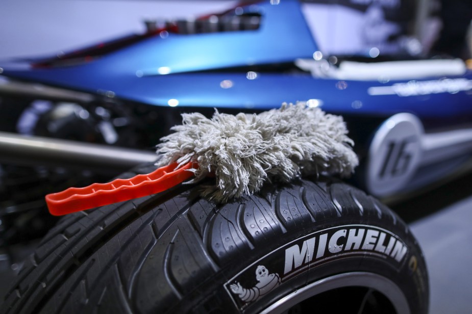 A duster sits on a Michelin tire. |