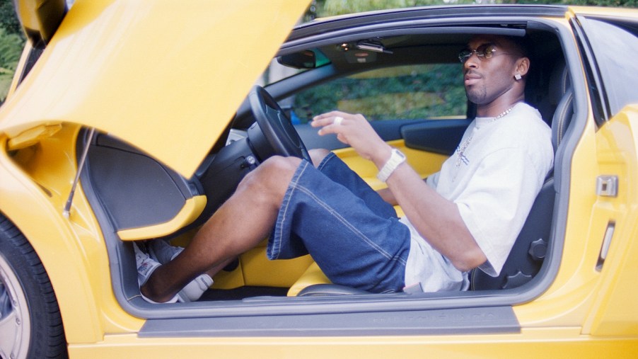 Kobe Bryant poses with his Lamborghini