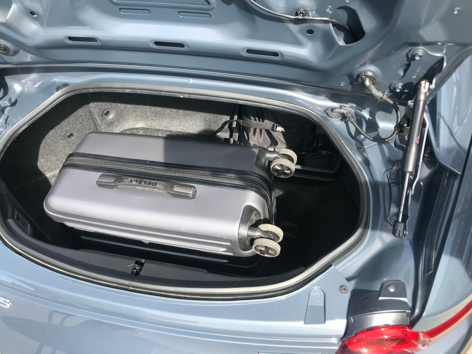 The small trunk space in the 2022 Mazda MX-5, which can only fit a carry-on bag.