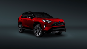 A promotional image of a red 2021 Toyota RAV4 Prime plug-in hybrid electric vehicle (PHEV)