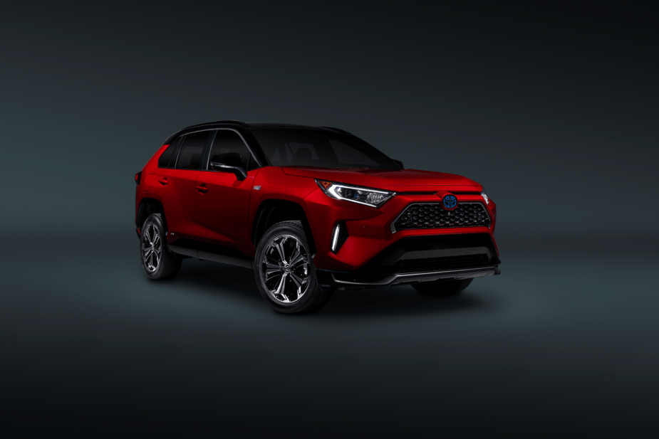 A promotional image of a red 2021 Toyota RAV4 Prime plug-in hybrid electric vehicle (PHEV)