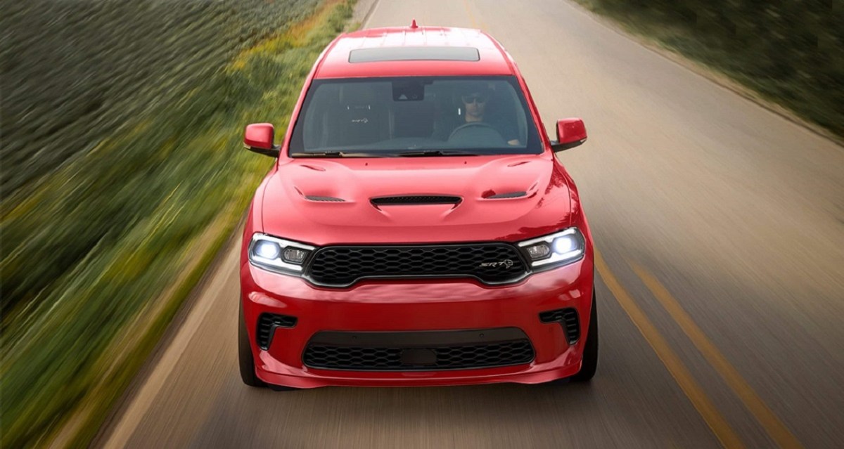 A red 2022 Dodge Durango driving down a road.
