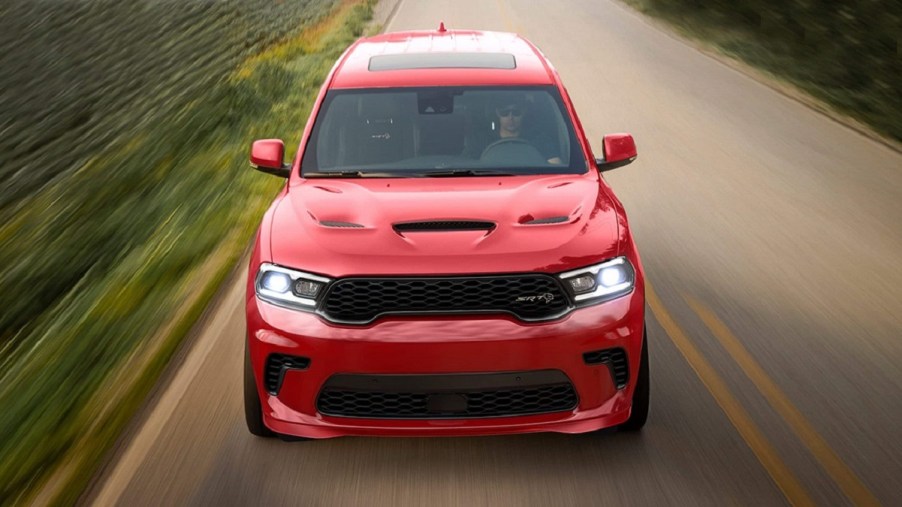 A red 2022 Dodge Durango driving down a road.