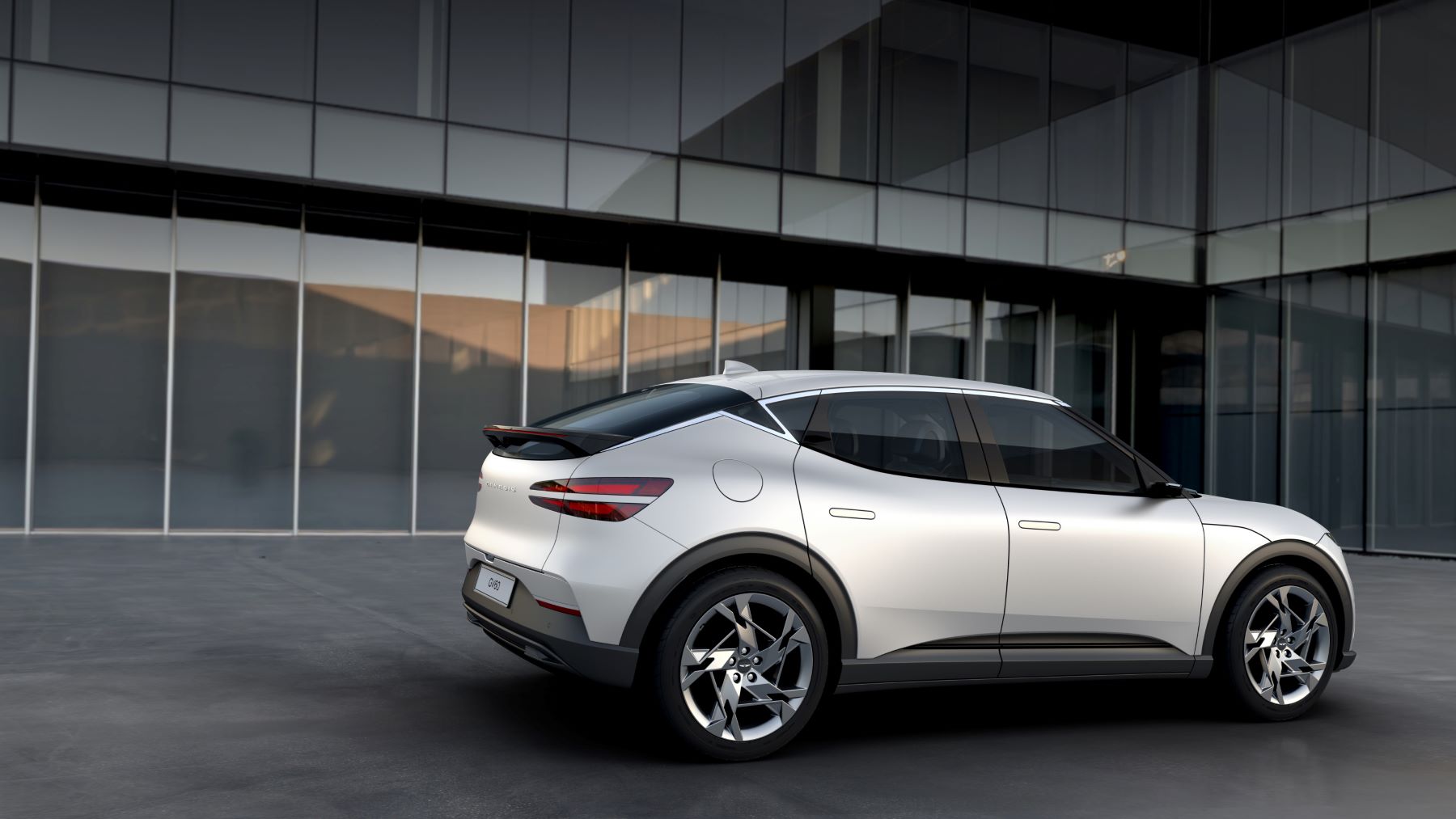A white 2023 Genesis GV60 luxury electric compact SUV model