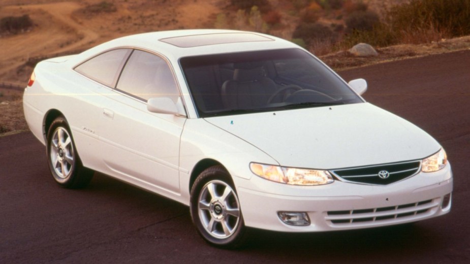a white 1999 toyota camry solara, a two door that could be upgraded with a supercharger for even more performance