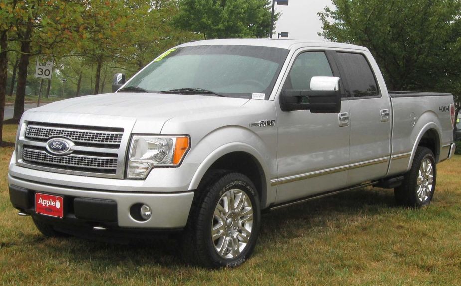 A 2010 Ford F-150 sits in a grassy field.