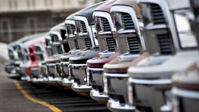 Dodge Ram pickup trucks at a Chrysler Dodge Jeep dealership in Peoria, Illinois