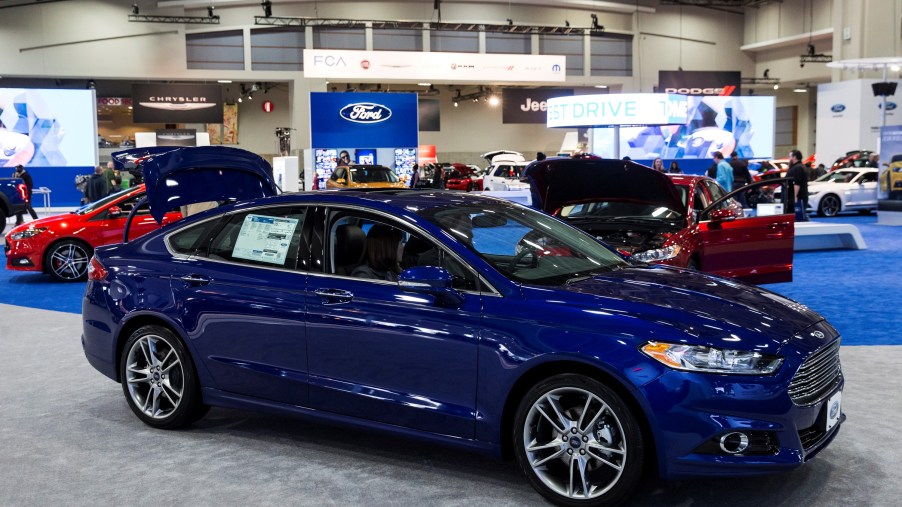 A blue 2015 Ford Fusion parked inside. It's one of the best used Fusion model years to buy.
