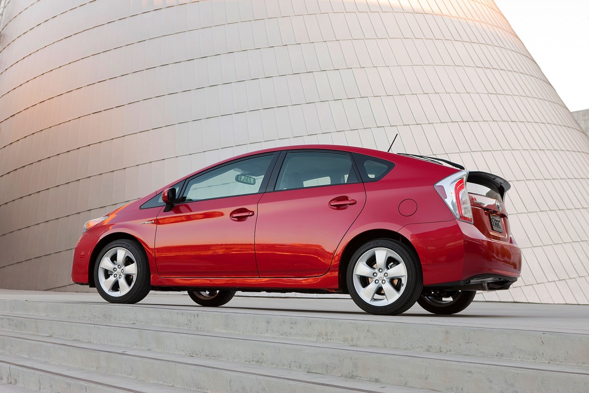 A red 2017 Toyota Prius parked, the Prius is among the best used hybrids