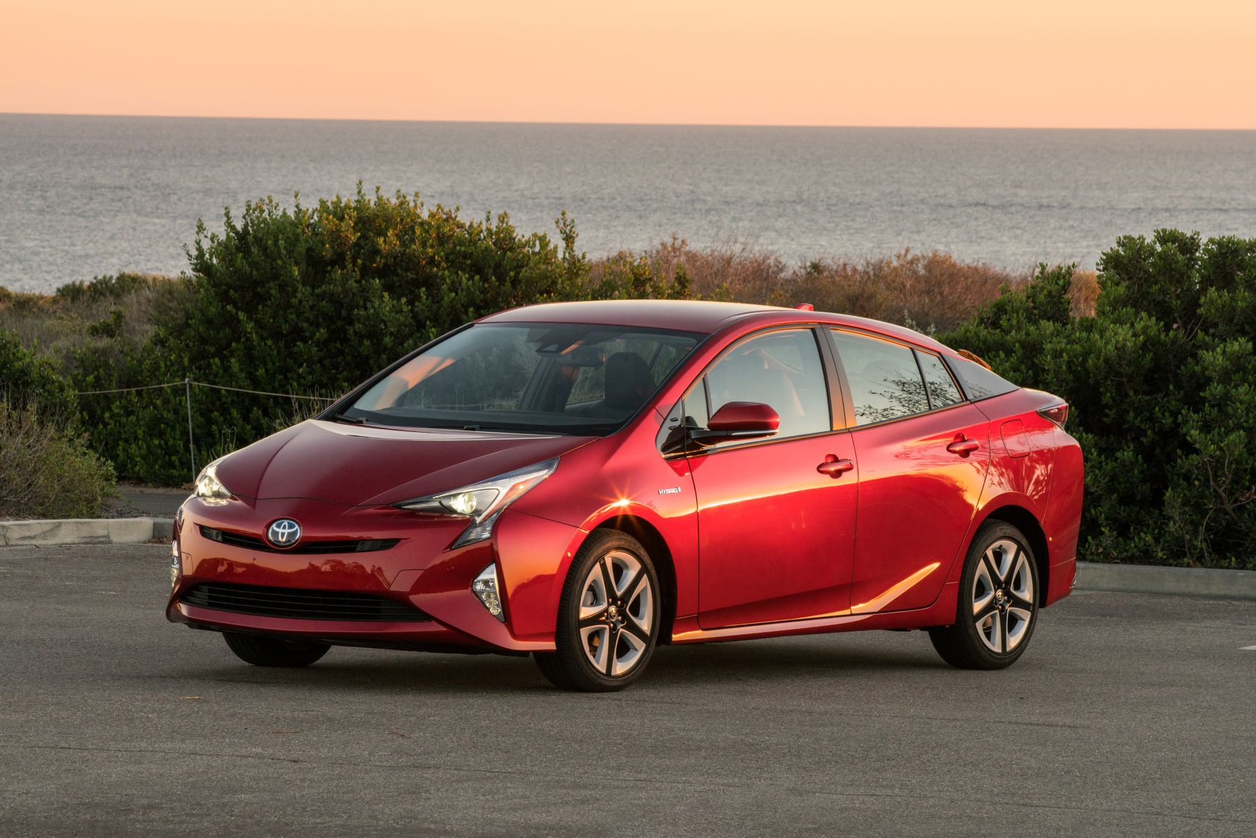 2016-2018 Toyota Prius Four Touring hybrid hatchback model in red