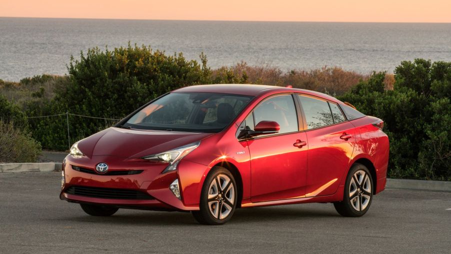 2016-2018 Toyota Prius Four Touring hybrid hatchback model in red