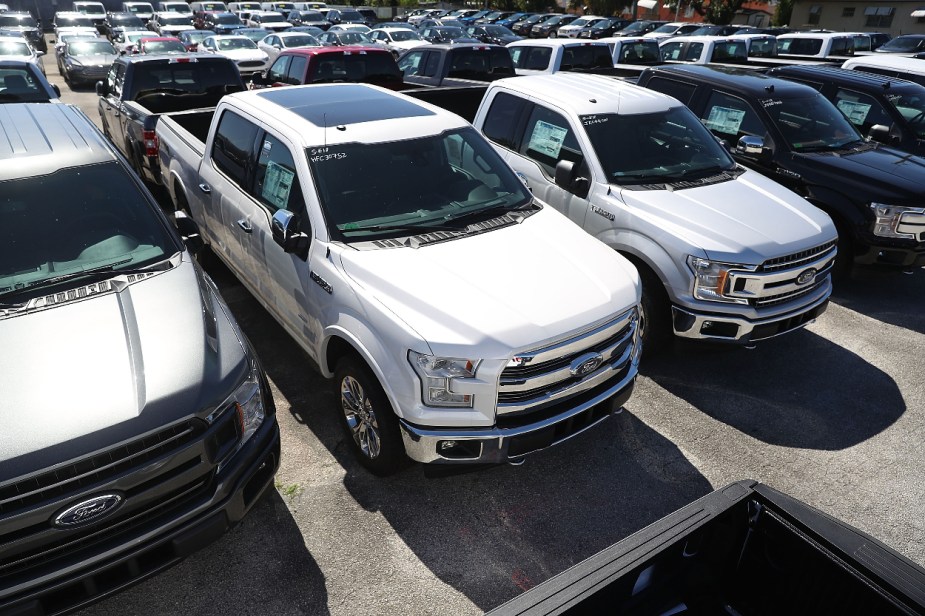 A group of 2017 Ford F-150 full-size truck models sit at a dealership lot, is it good for towing?