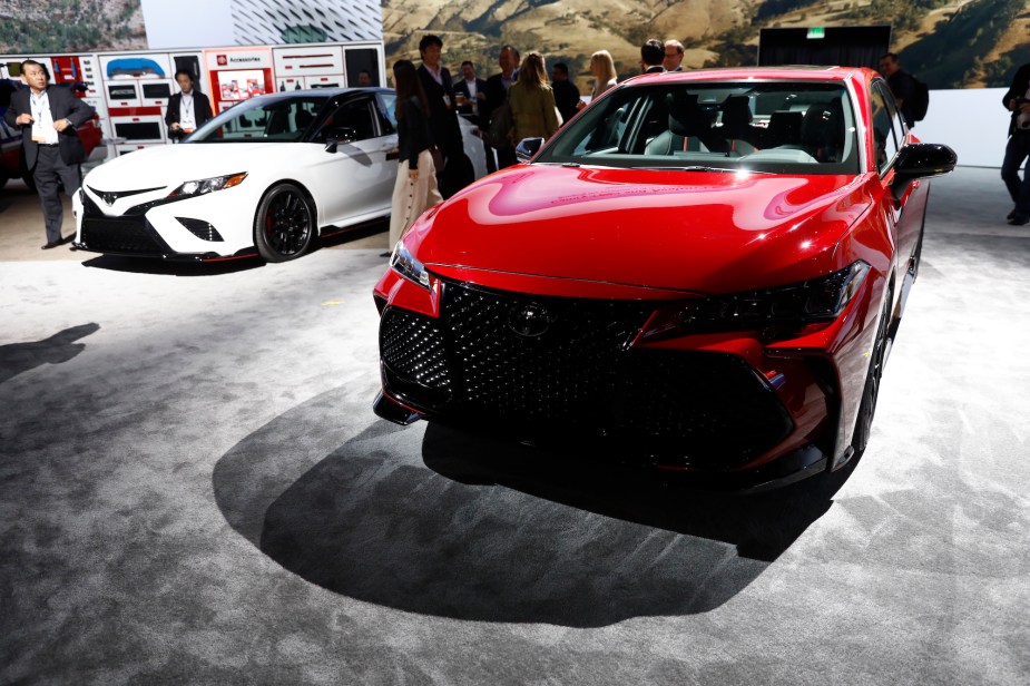 A red and white 2018 Toyota Camry.