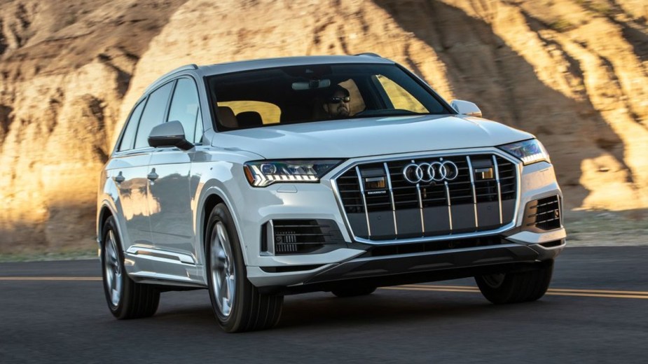 White 2022 Audi Q7 driving on the road