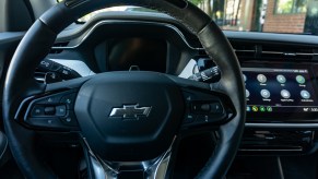 A 2022 Chevrolet Bolt EUV Premier's black-and-silver steering wheel with Super Cruise controls