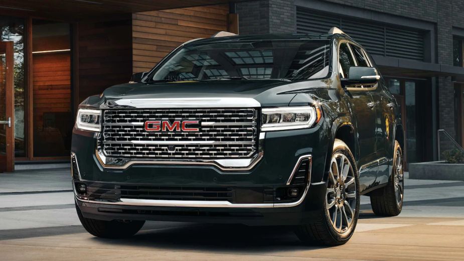A 2022 GMC Acadia Denali parked outside. Is the fully loaded trim level worth the money?